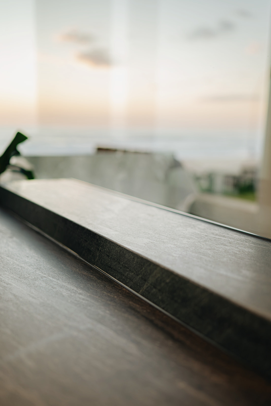 Close up of a stone sill and glazing junction sealed to a straight line