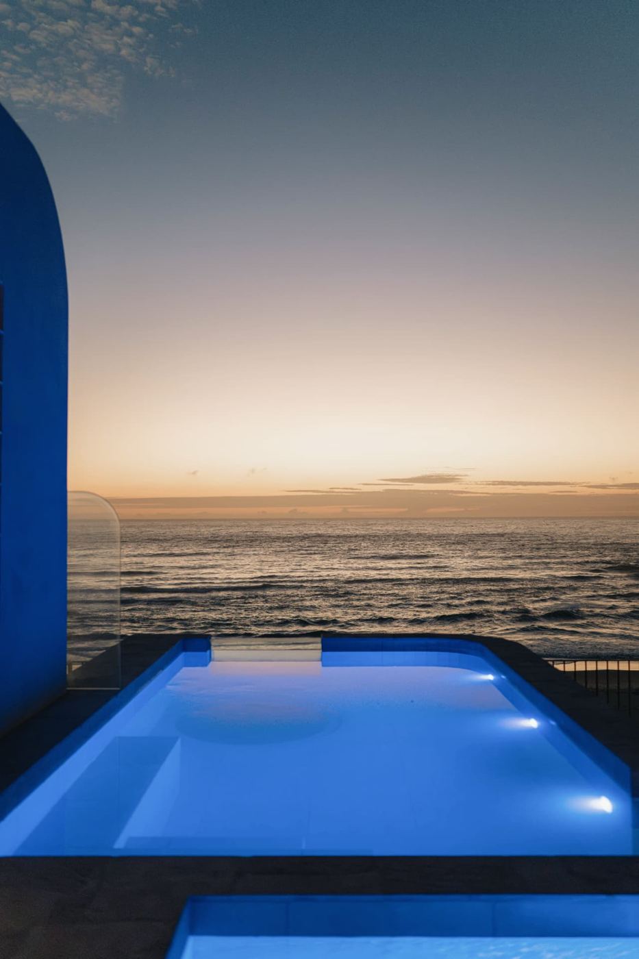 Oceanfront pool sealed at dusk